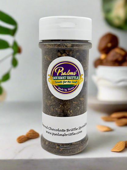 Handcrafted Almond Chocolate Coconut Brittle Sprinkles featuring crushed golden brittle pieces with dark chocolate swirls, toasted coconut flakes, and premium almond bits in a clear resealable jar