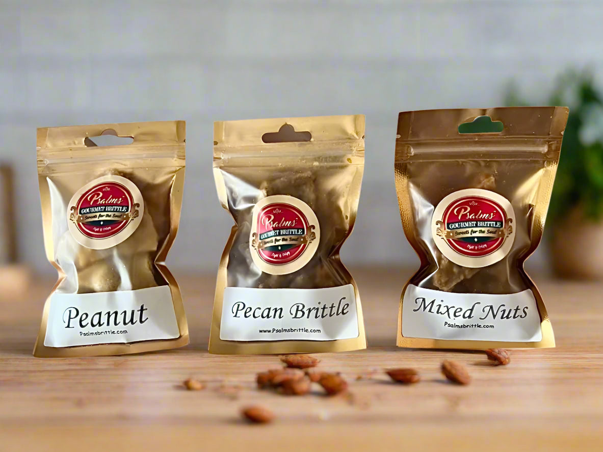 Psalms Gourmet Brittle Sample Pack featuring an assortment of handcrafted artisanal brittles including pecan, peanut, and cashew varieties in a premium gift package