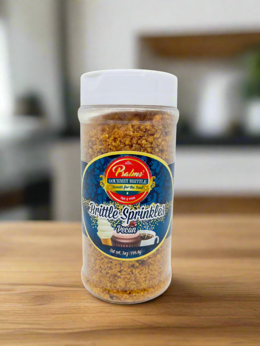 Psalms Gourmet Pecan Brittle Sprinkles featuring perfectly crushed golden brittle pieces with premium Georgia pecan bits in a clear resealable jar